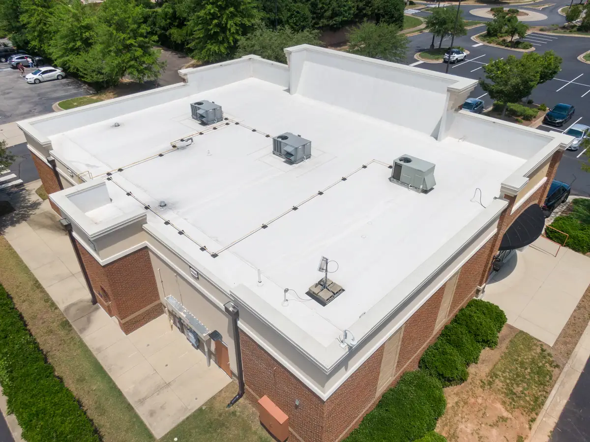 White TPO membrane roof on a commercial building
