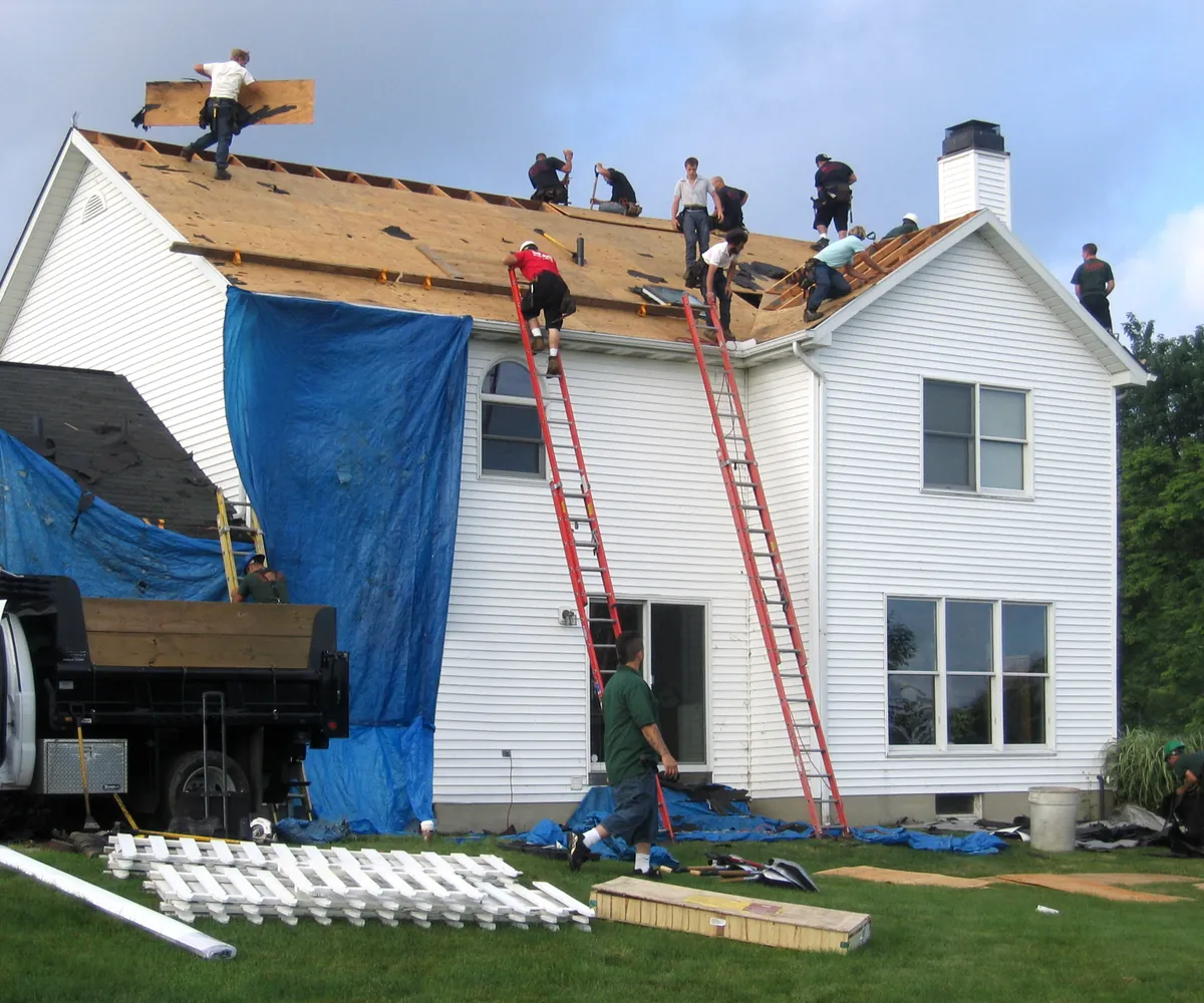 Roofing crew replacing a home’s roof